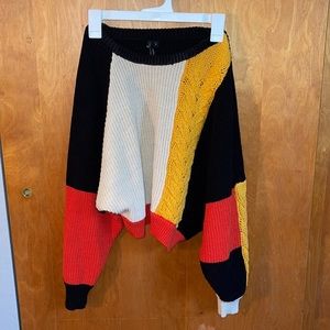 Red, black, mustard yellow slightly cropped sweater. Size small.